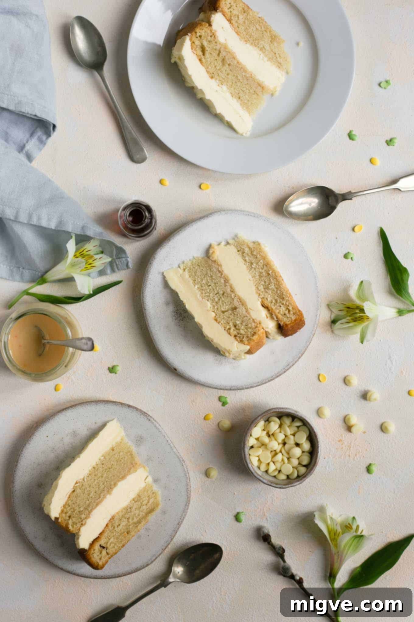 Delicious and indulgent white chocolate cake with a hidden layer of blood orange curd – a dairy-free masterpiece. #vegan #foodphotography #cake #dairyfree
