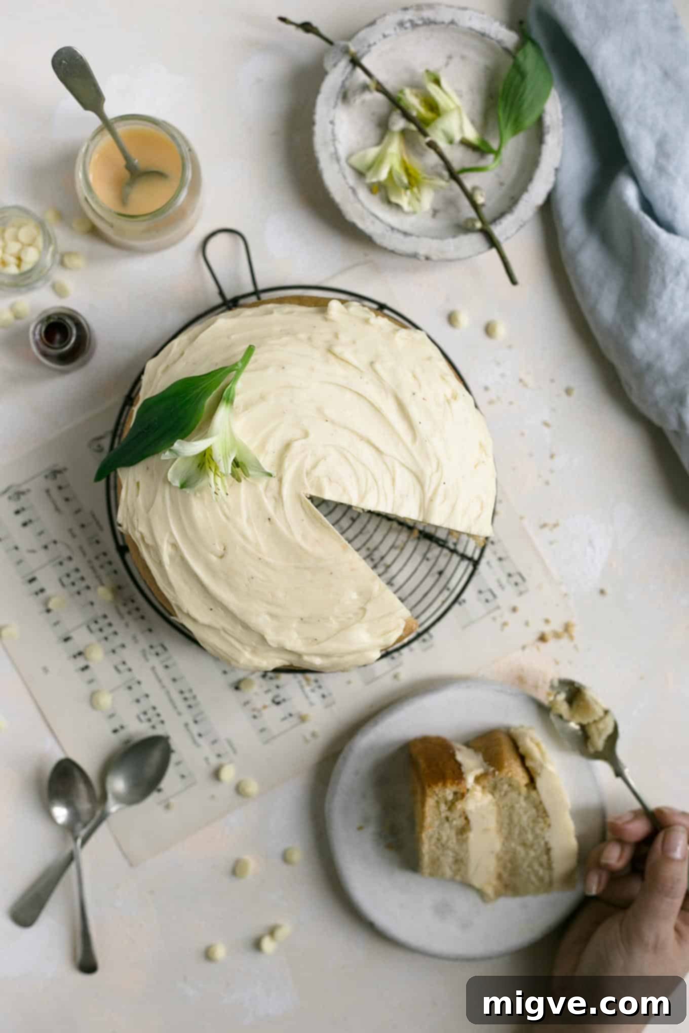 Two-layer vegan cake featuring luscious white chocolate frosting and a tangy blood orange curd filling. #dairyfree #foodphotography #cake