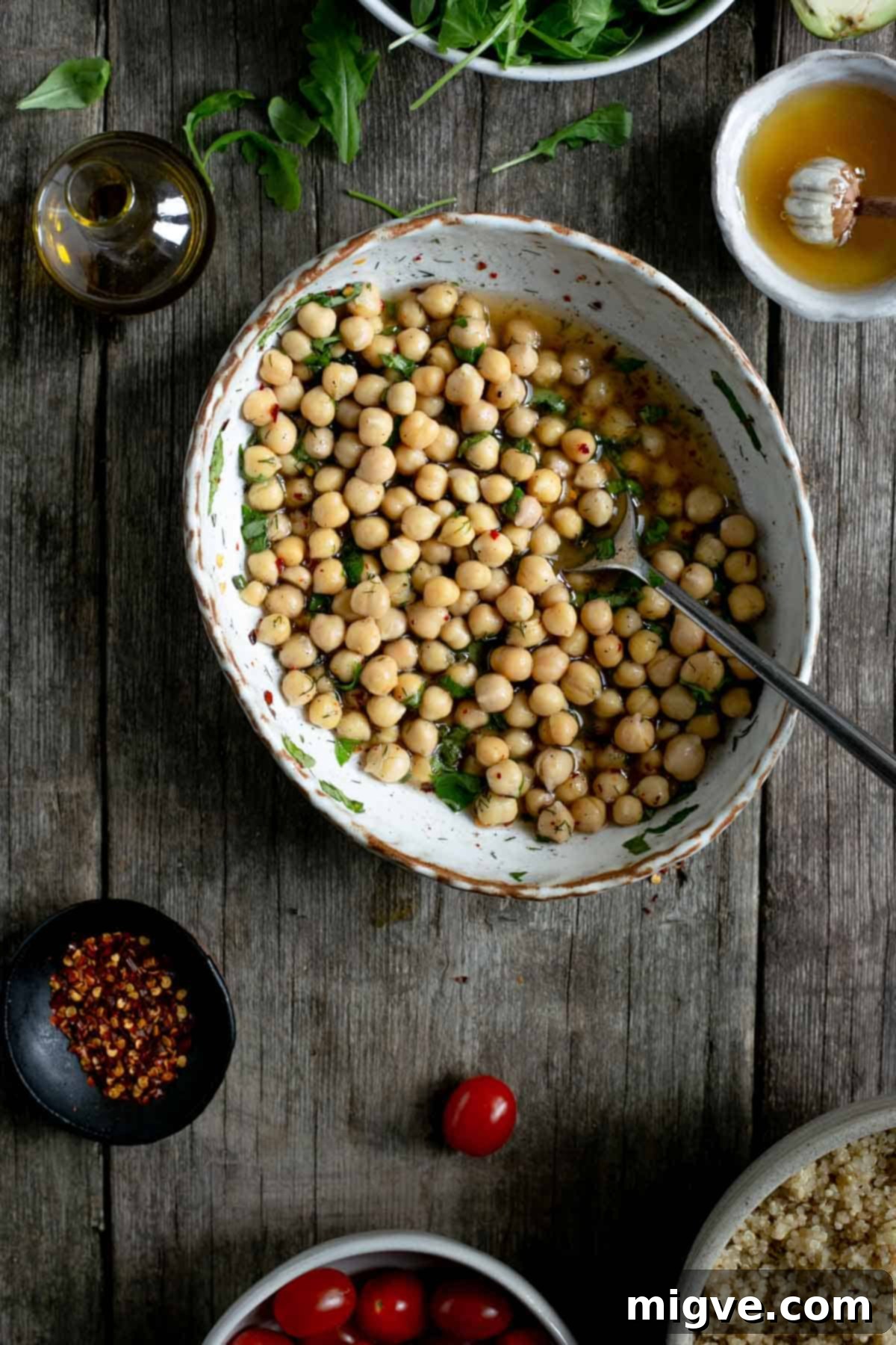 Marinated chickpeas for tomato and quinoa salad jars - a key vegan ingredient for delicious salad jars.