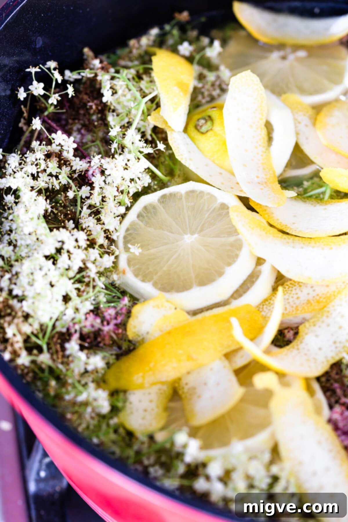 45 degree angle view of cordial being cooked in a large pan