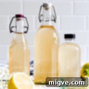 straight ahead close up at glass bottles with elderflower cordial