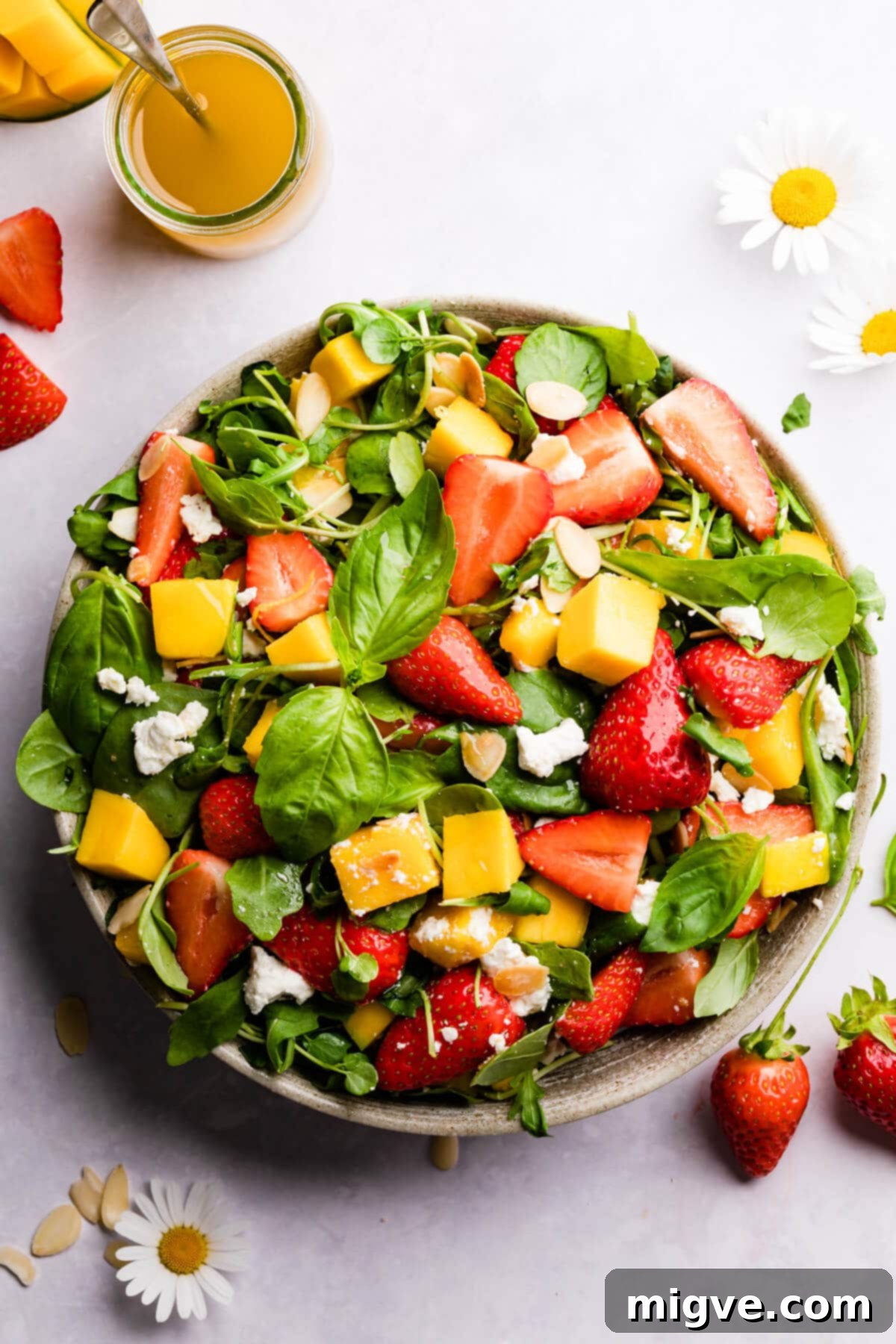 top view close up of fresh strawberry salad with mango and feta cheese