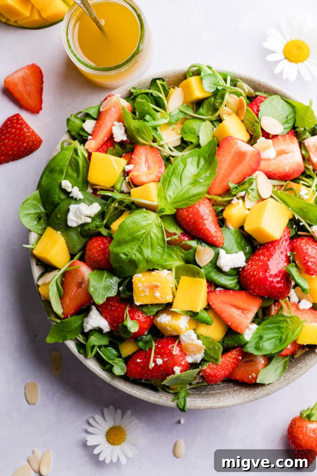 top view close up at salad with mango and strawberries