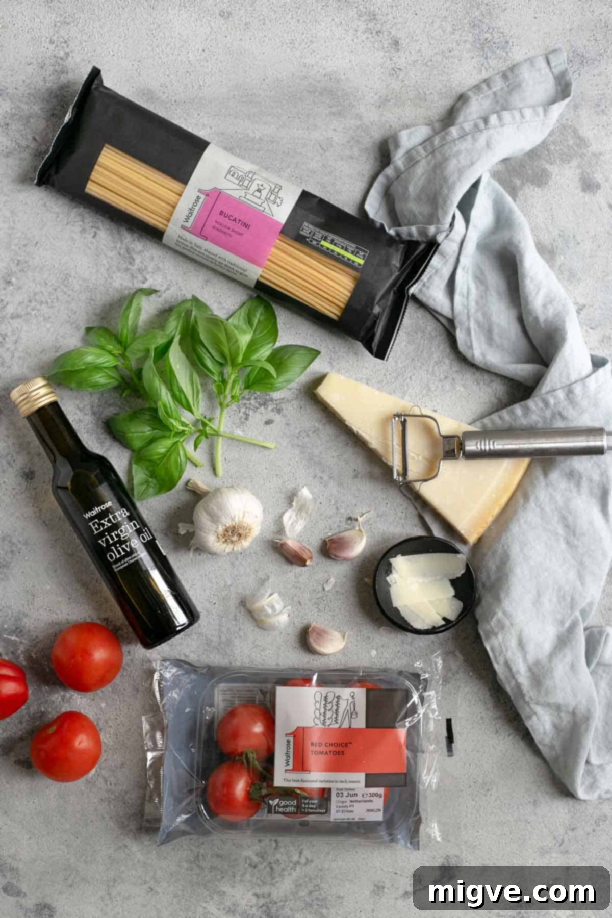 Fresh bucatini pasta with roasted tomatoes and basil, showcasing the vibrant colors and six simple ingredients