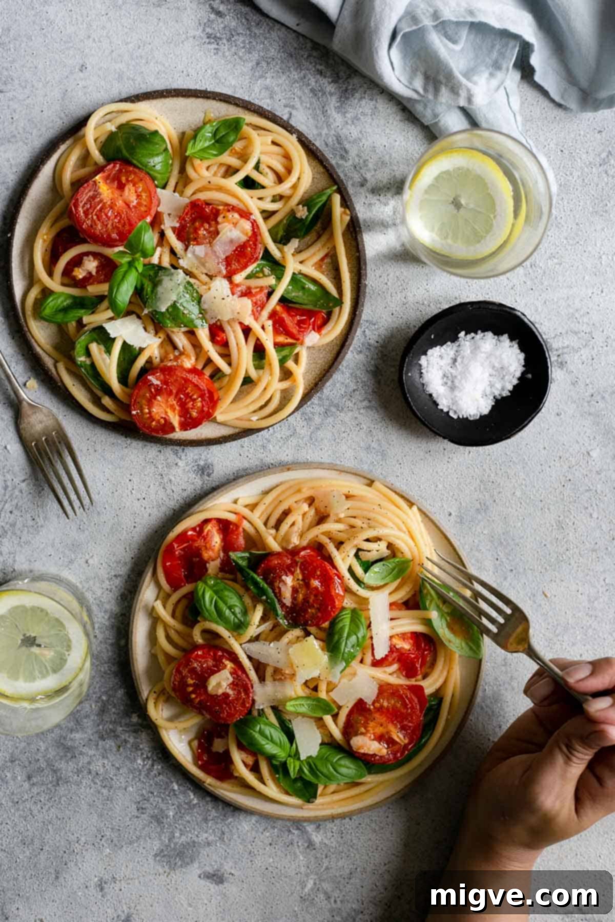 Effortless and wonderful bucatini pasta with perfectly roasted tomatoes and vibrant fresh basil, a truly simple recipe