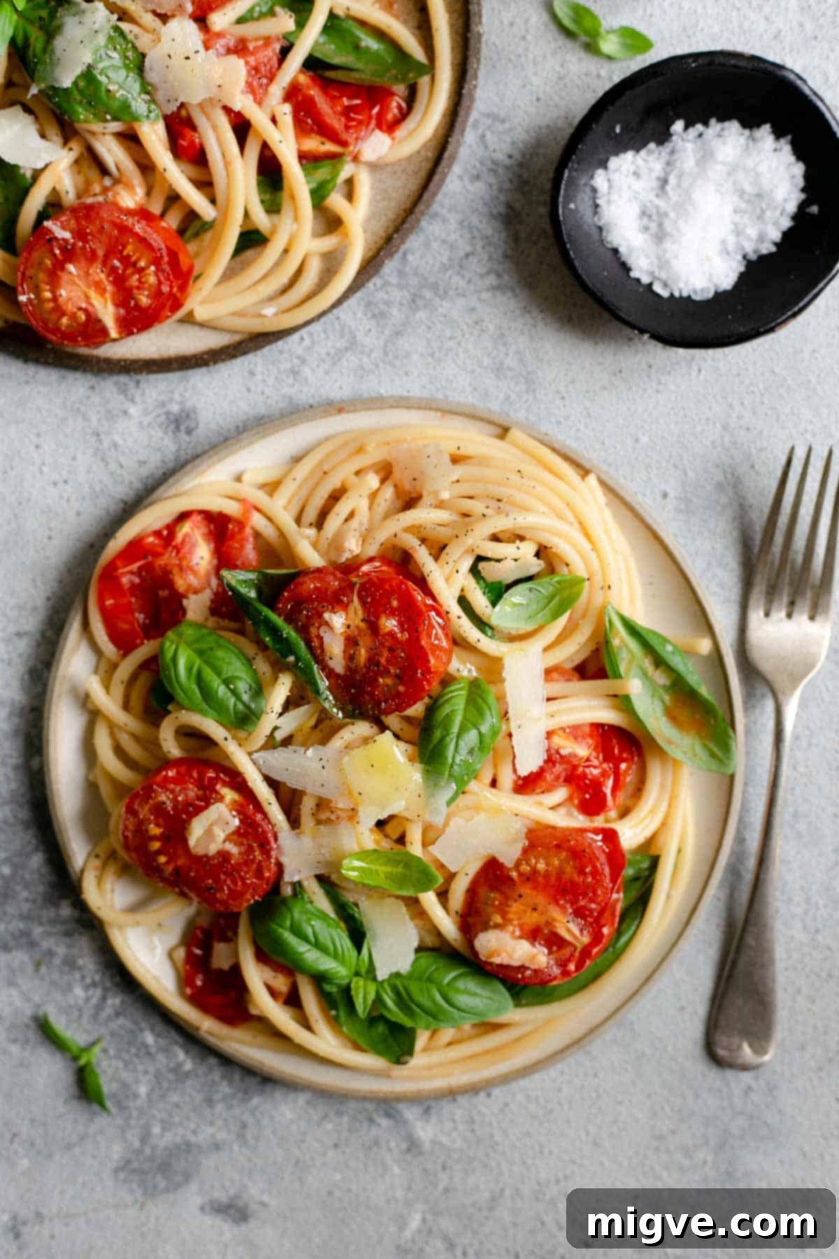 Super simple bucatini pasta recipe with juicy, oven-roasted tomatoes. An easy and delicious dish, perfect for a whole family