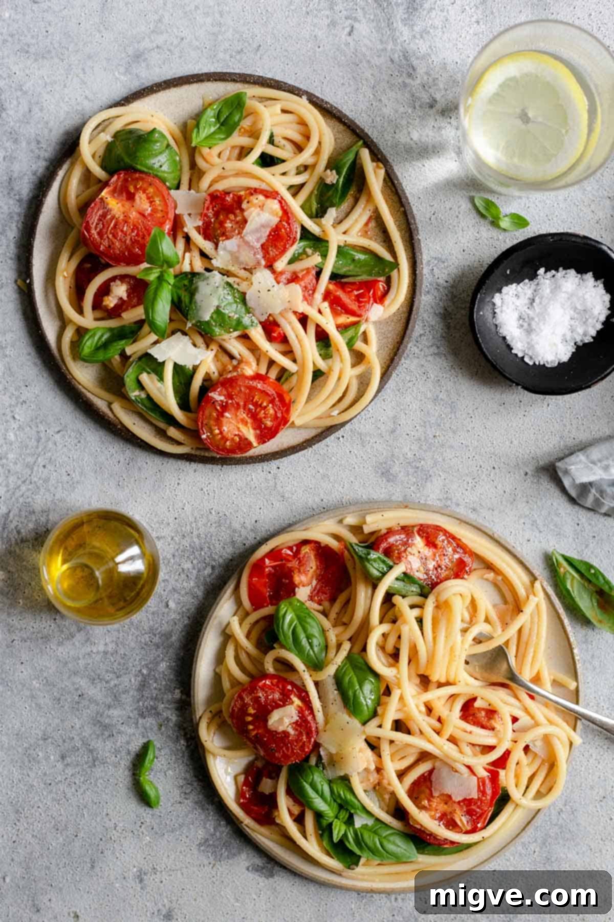 Beautiful and flavorful bucatini pasta with roasted tomatoes and basil, a simple, vegetarian, and meat-free recipe
