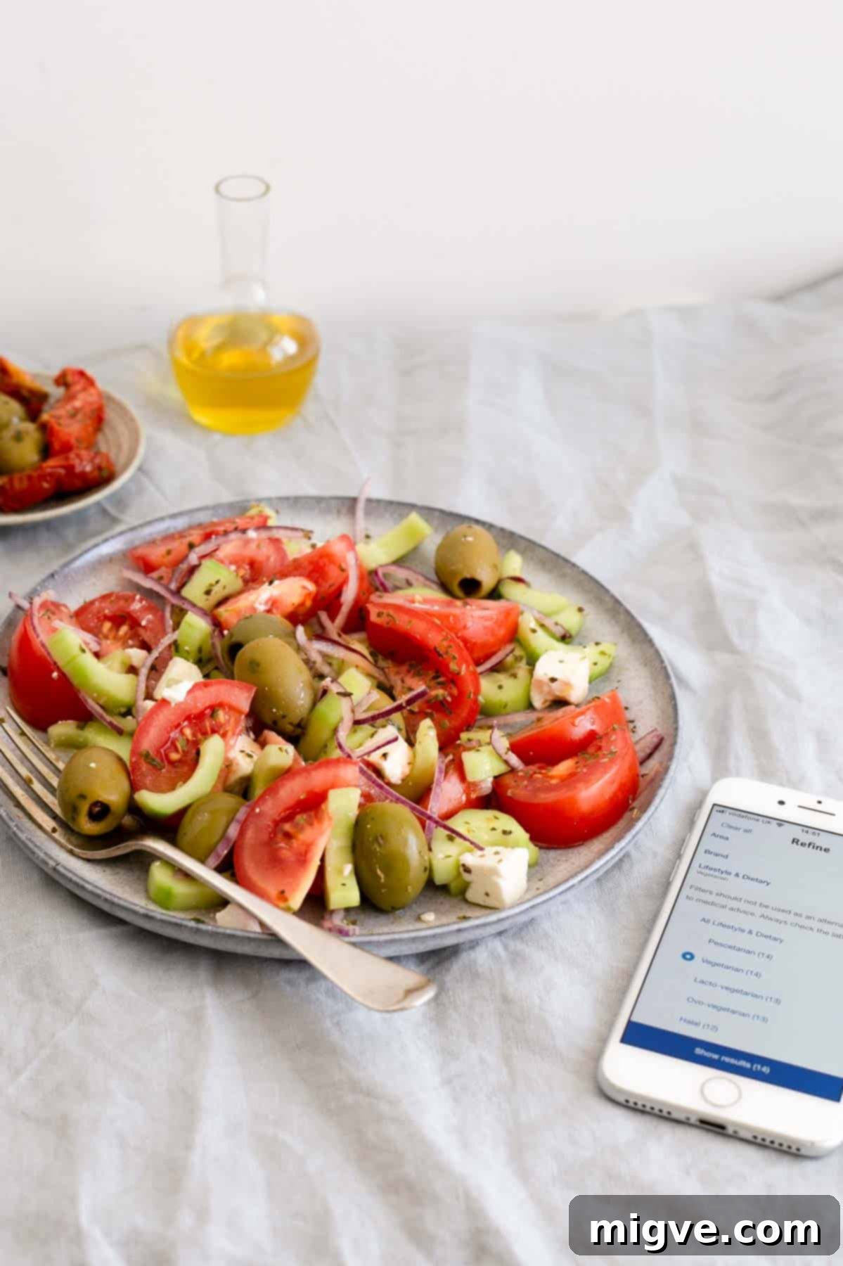 Effortless Greek Salad 2 Easy Greek salad featuring fresh tomatoes, crisp cucumbers, thinly sliced red onion, briny olives, and creamy feta cheese. Perfect for healthy summer meals, easily shop ingredients with Tesco's online dietary filters.