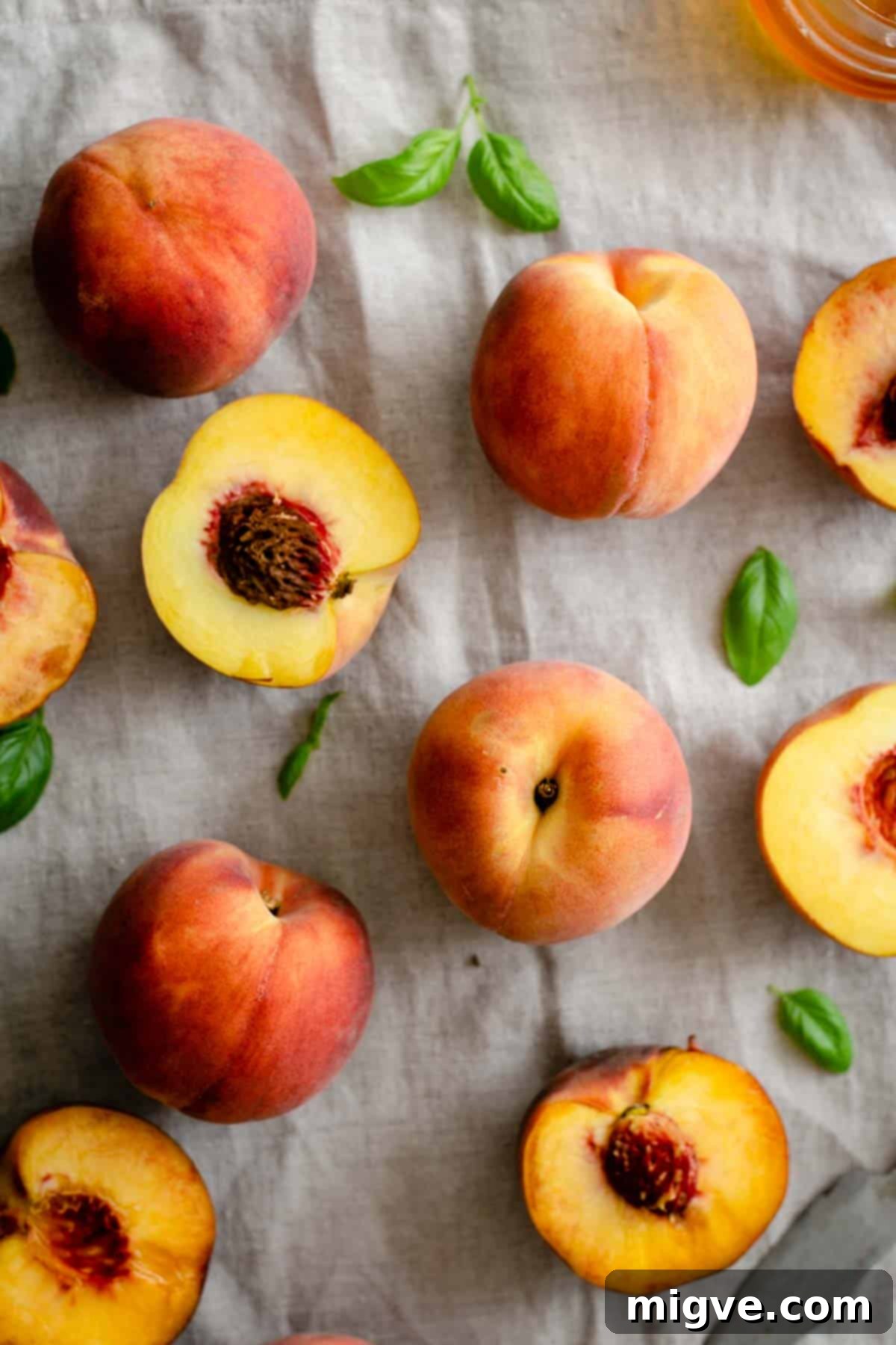 Wholesome Golden Peach Tart 2 Fresh peaches on linen tablecloth
