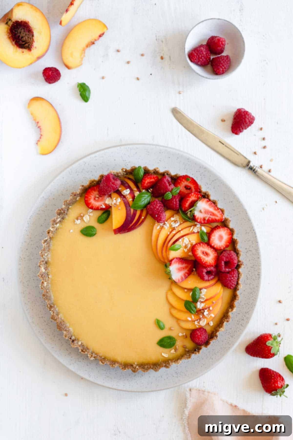 Wholesome Golden Peach Tart 3 Overhead shot of vegan peach tart with fresh summer fruit