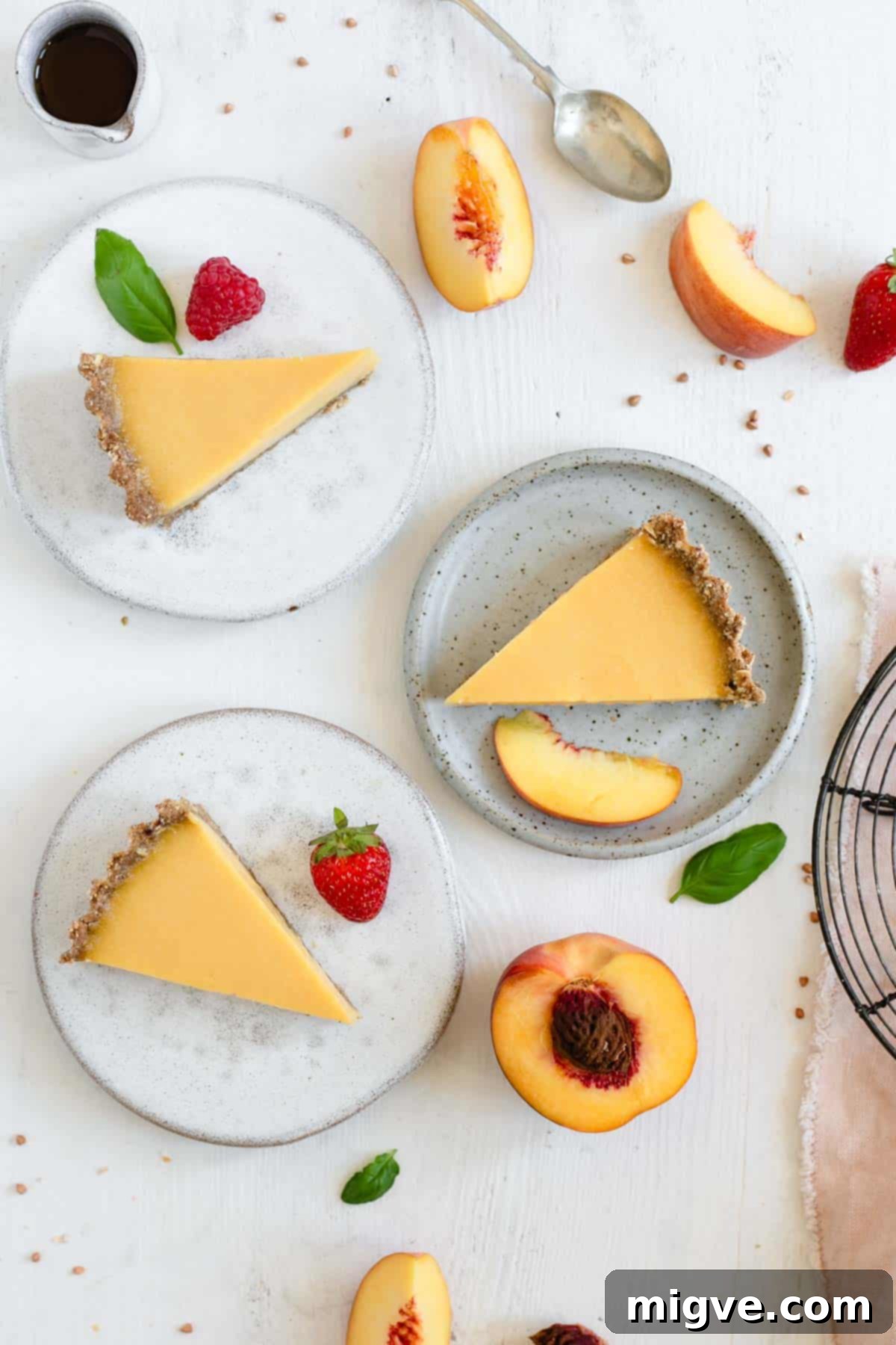 Wholesome Golden Peach Tart 7 Three slices of vegan peach tart on the plates, overhead shot