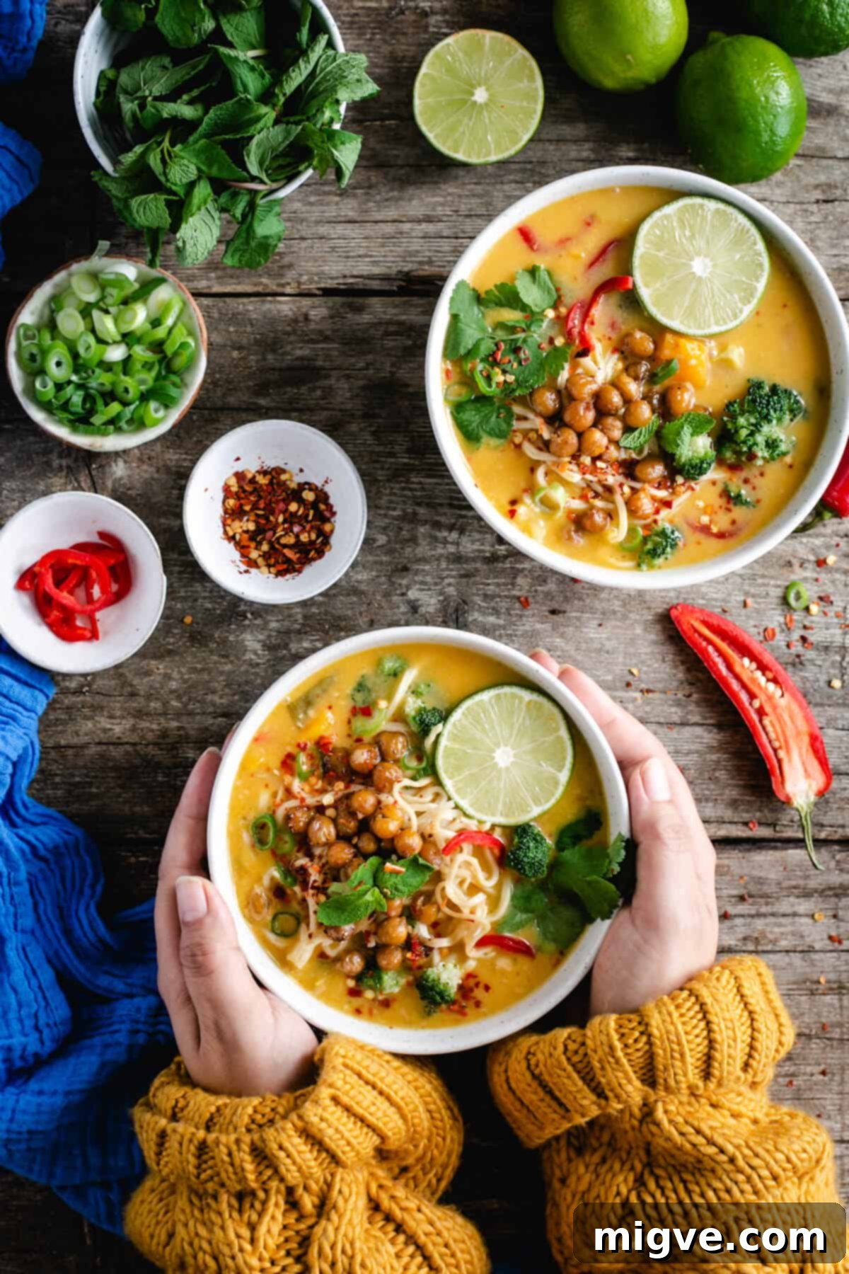 Overhead shot of two bowls of Thai style pumpkin laksa