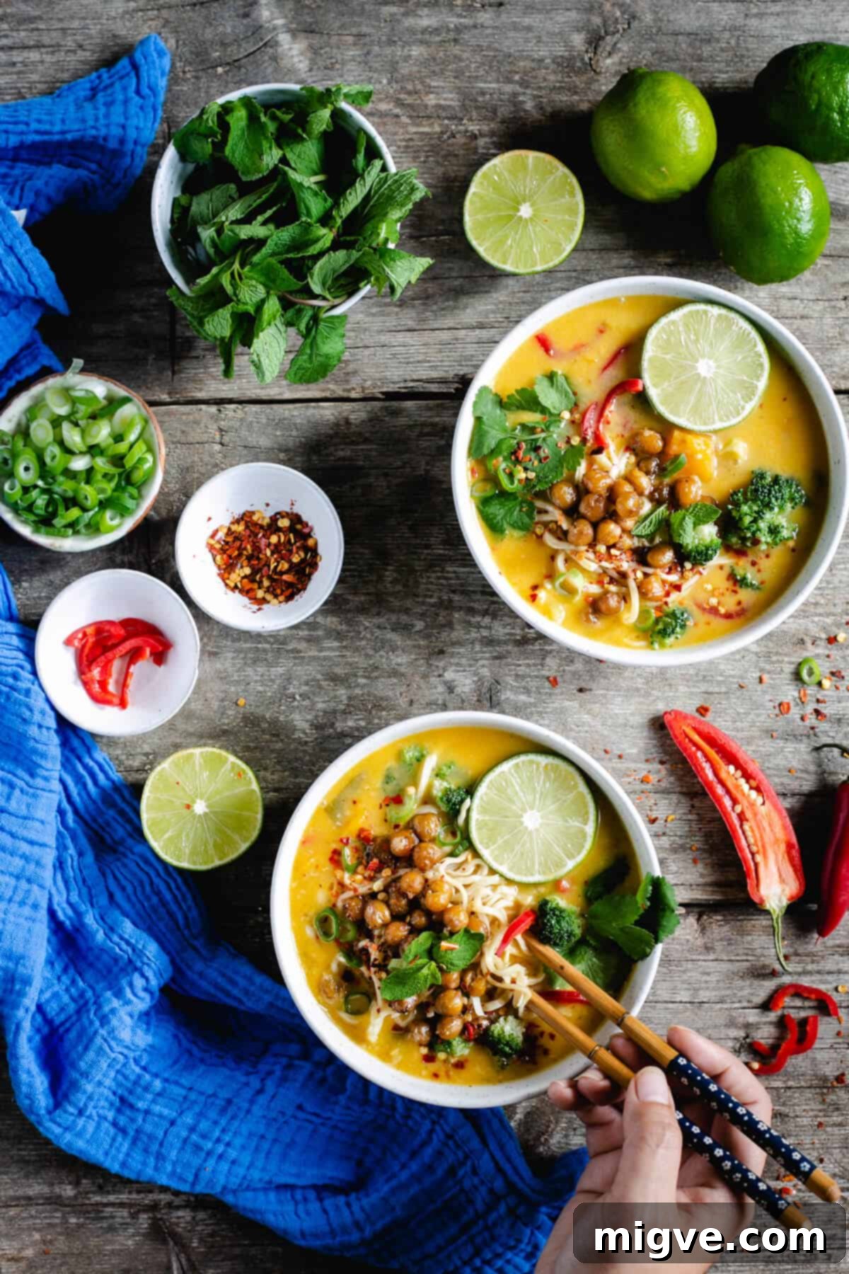 Overhead shot of two bowls of Thai style pumpkin laksa
