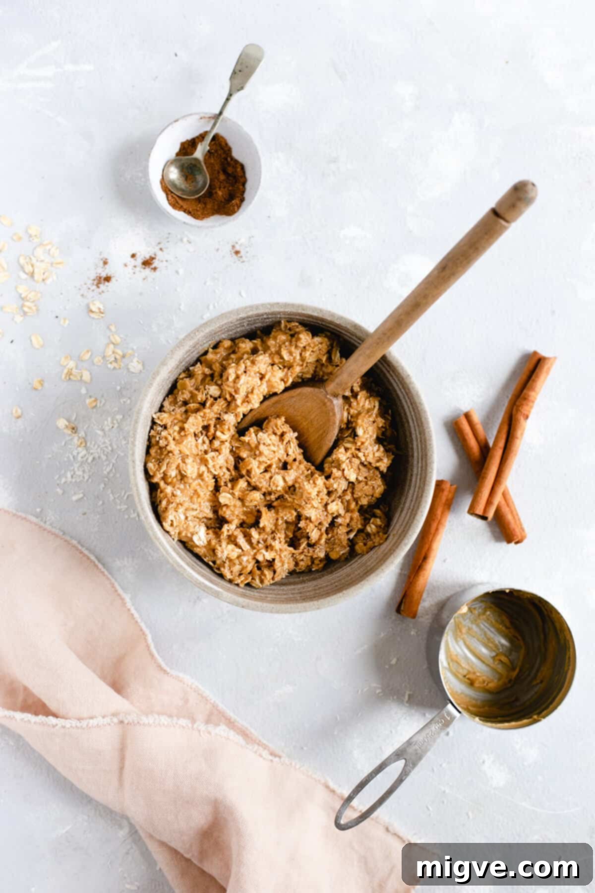 Spiced Coconut Peanut Power Bites 4 Overhead shot of a bowl with a delightful mixture of oats, coconut shreds, and peanut butter, ready to be formed into energy bites