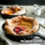 Berry Burst Dutch Delight 8 A small skillet with mixed berry dutch baby