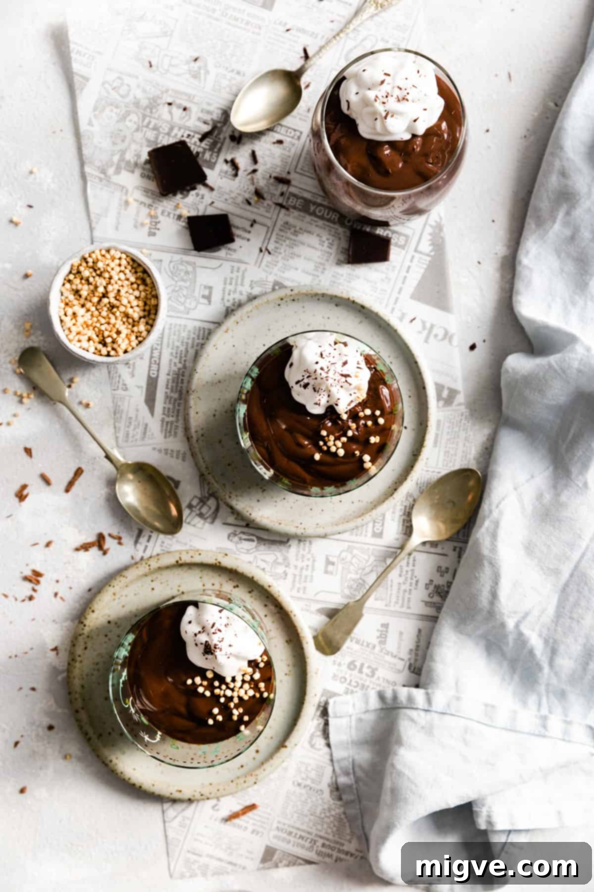 overhead shot of 3 glasses with vegan chocolate pudding
