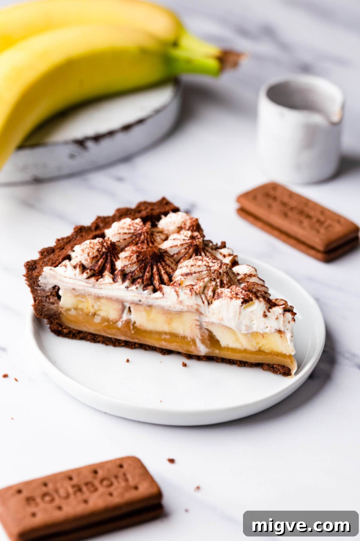 side close up at a slice of vegan banoffee pie on a dessert plate