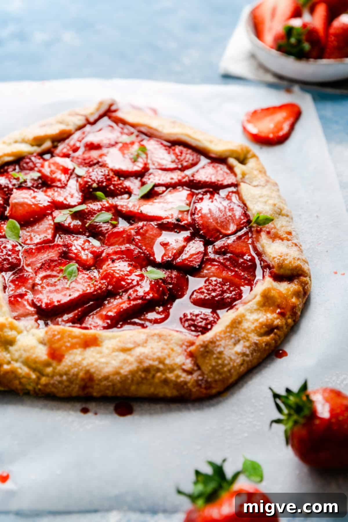 Rustic Strawberry Galette 11 angle shot of strawberry galette with some basil leaves on top