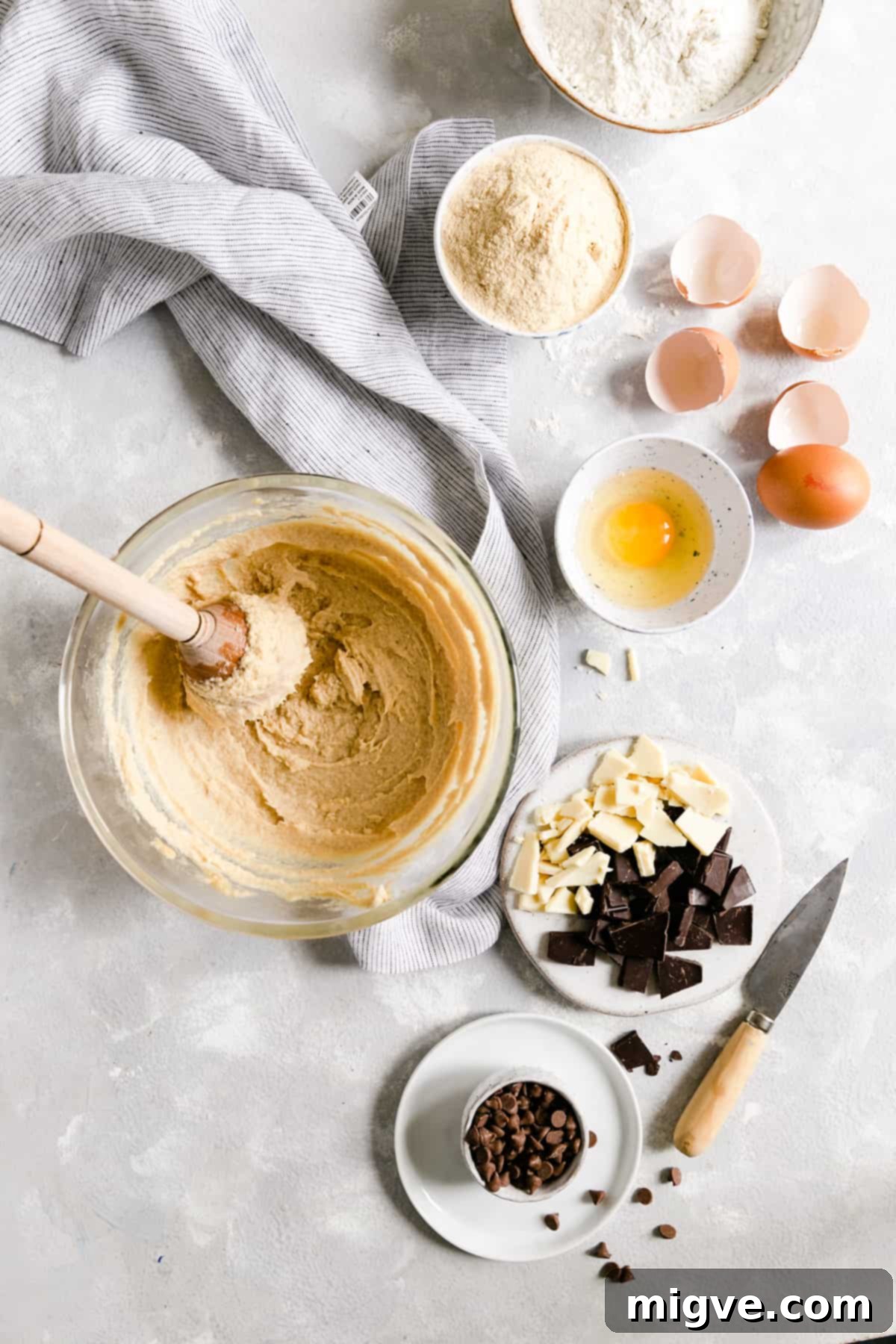 Top view of a large bowl showcasing the smooth, well-combined cookie dough mixture, ready for the dry ingredients.