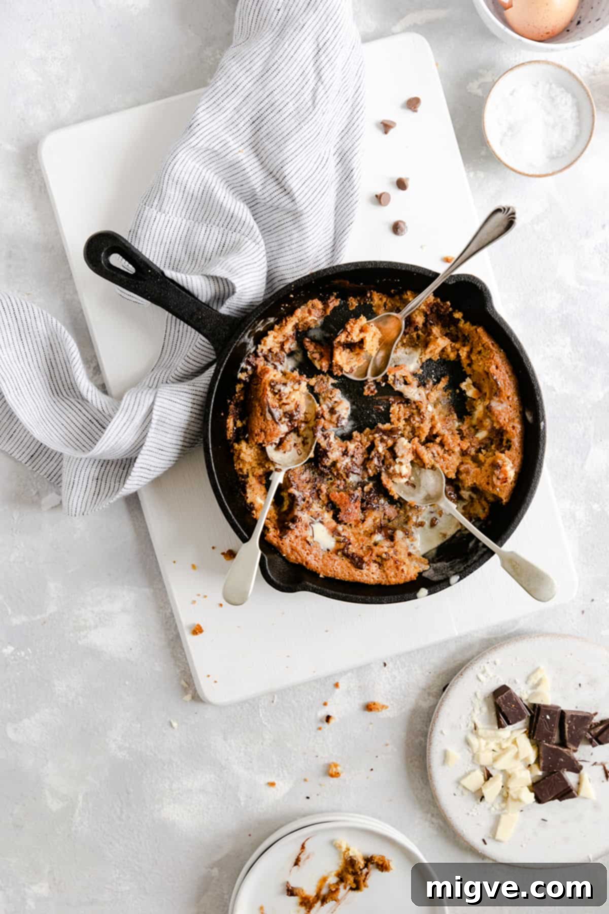 Top view of an almost empty skillet, with only a few delightful remnants of the chocolate chip and malted milk cookie left inside, hinting at how quickly it was devoured.