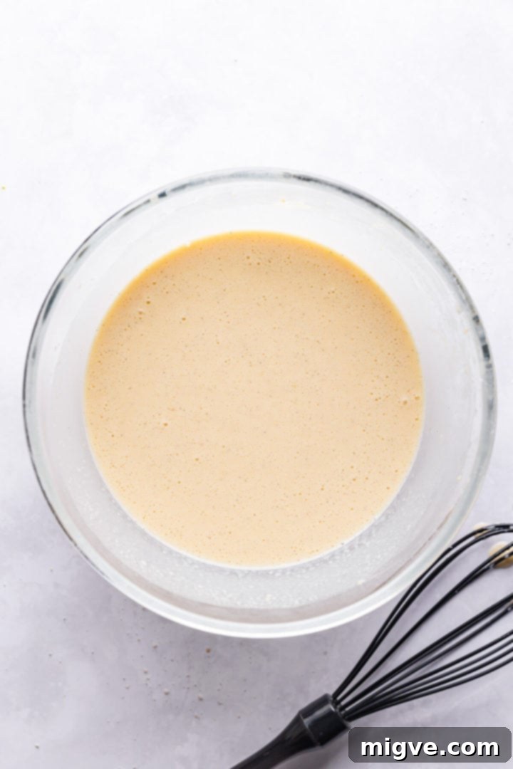 top view of a bowl filled with batter for clafoutis
