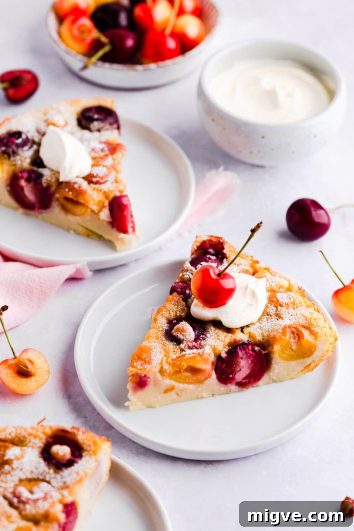close up of a slice of cherry clafoutis with a bite taken out