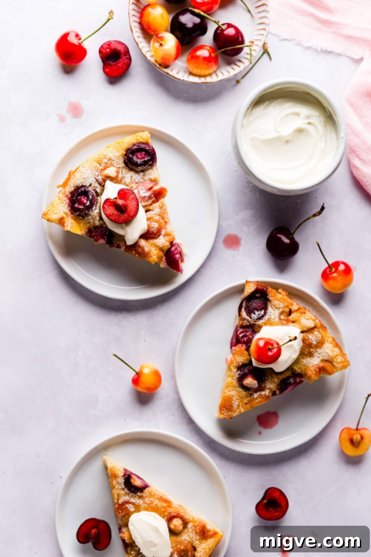 slices of cherry clafoutis on individual plates