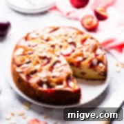 45 degree angle view at plum cake with slice missing