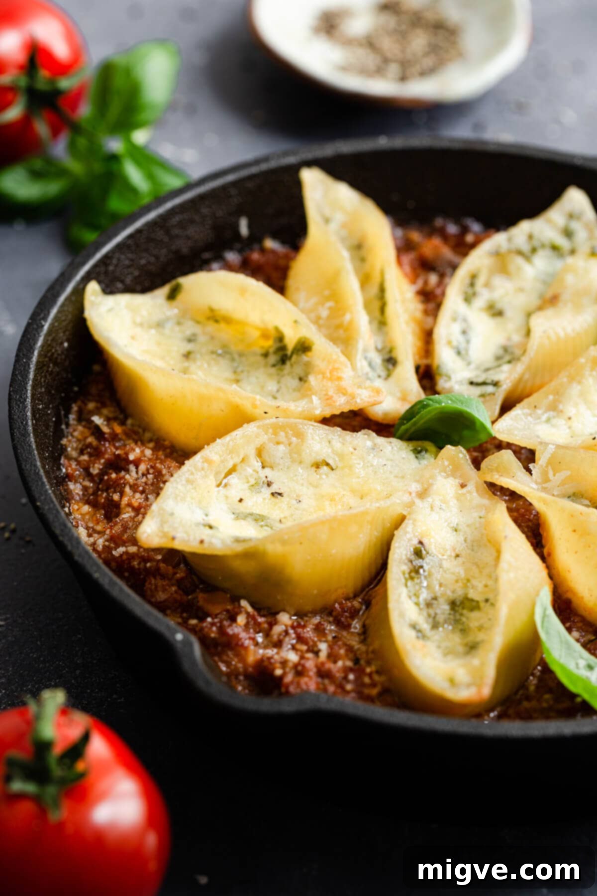 side view of stuffed pasta shells bake in a pan, ready to serve