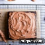 overhead shot of square chocolate cake on a wire rack