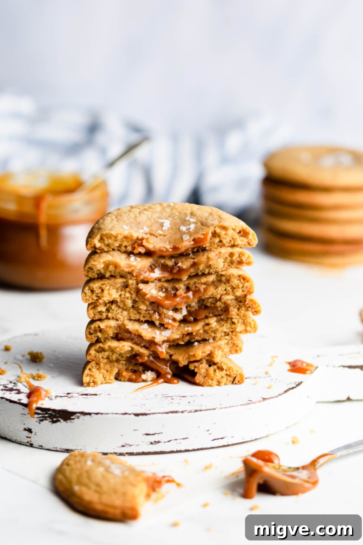 45 degree angle close up at a stack of cookies filled with dulce de leche