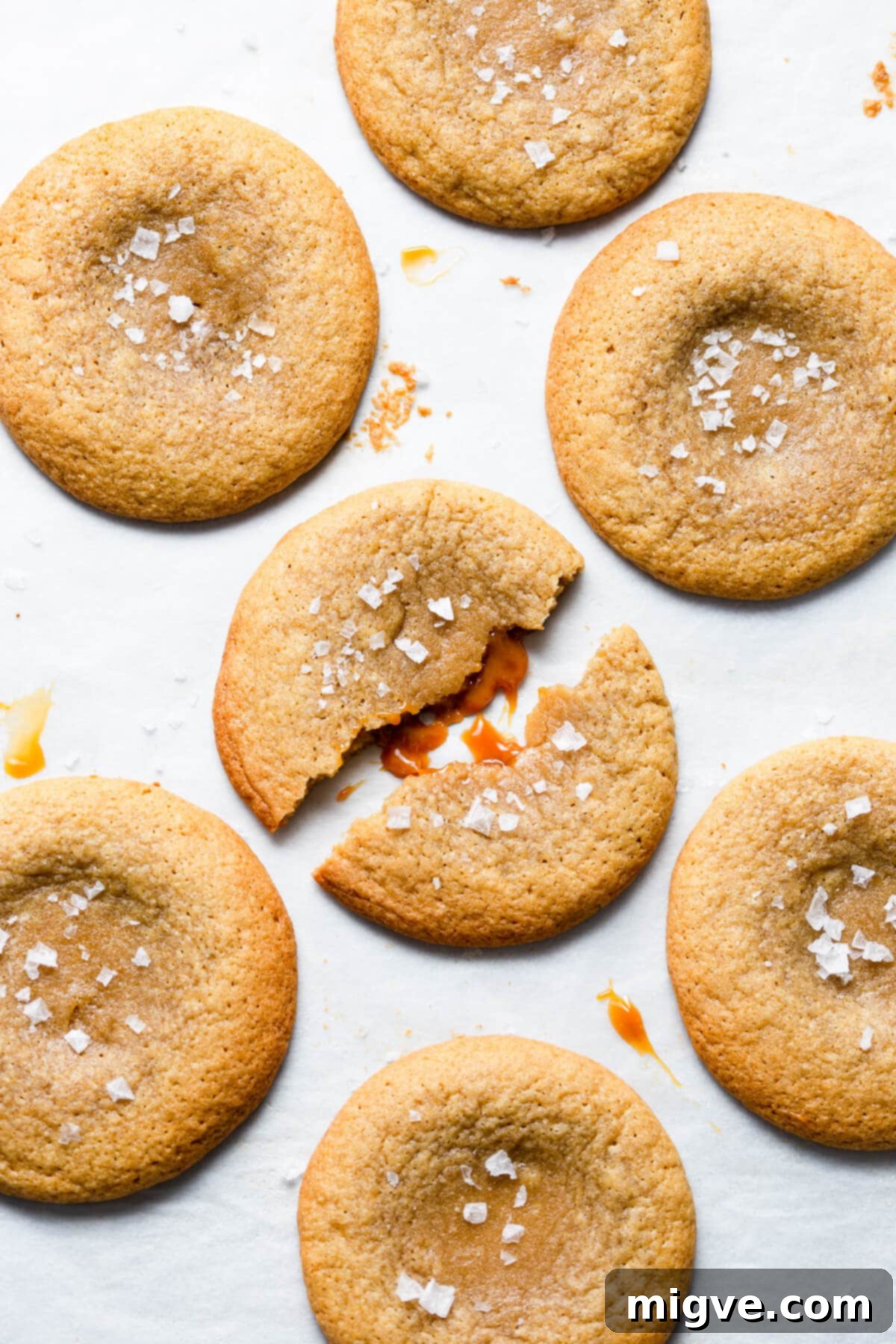 top view close up at a cookie split in half with the filling coming out of it
