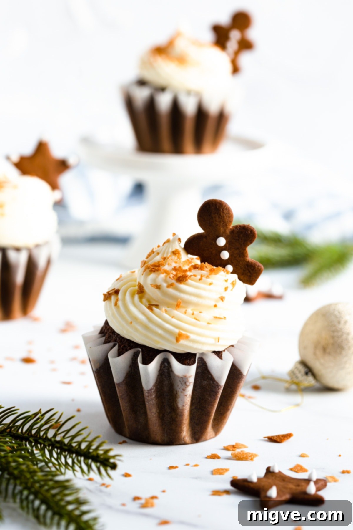 Holiday Gingerbread Delights with Cream Cheese Clouds 6 side close up of gingerbread cupcake with cream cheese frosting