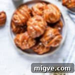 overhead shot of a plate with golden cardamom buns