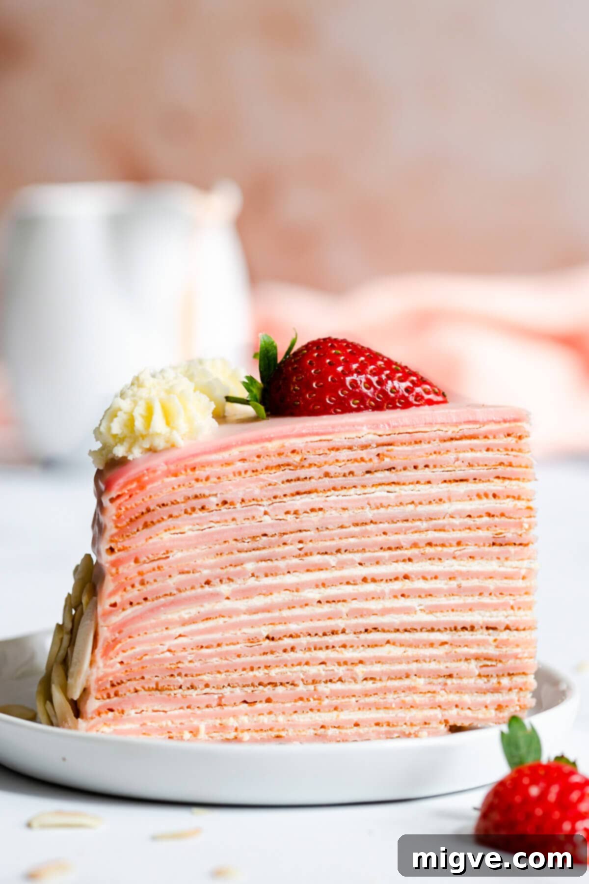 Decadent Chocolate Crepe Dream 13 side super close up at a slice of strawberry crepe cake