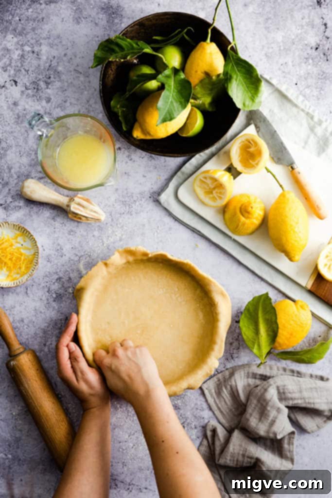 A disk of prepared pastry dough, wrapped in clingfilm, ready for chilling.
