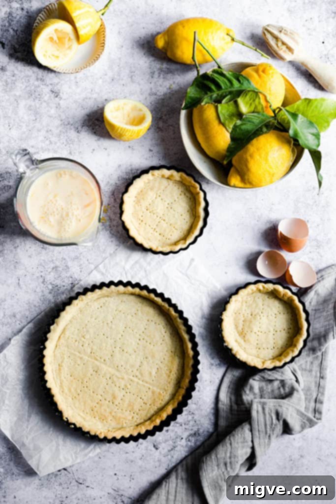 The base of the pastry crust pricked with a fork, ready for blind baking.