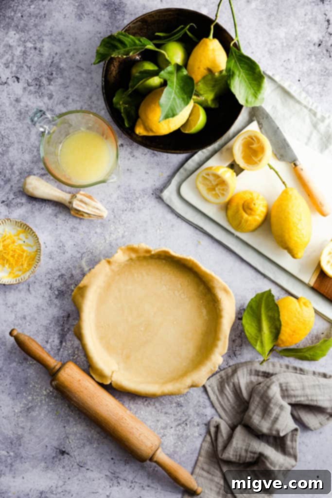 Close-up of pastry dough being kneaded gently on a floured surface.