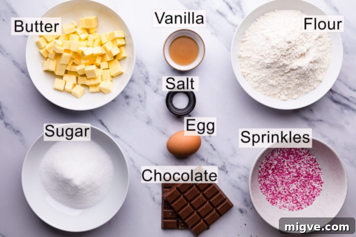 Sweetheart Sugar Cookies 3 Labeled ingredients for Valentine sugar cookies laid out on a white surface.