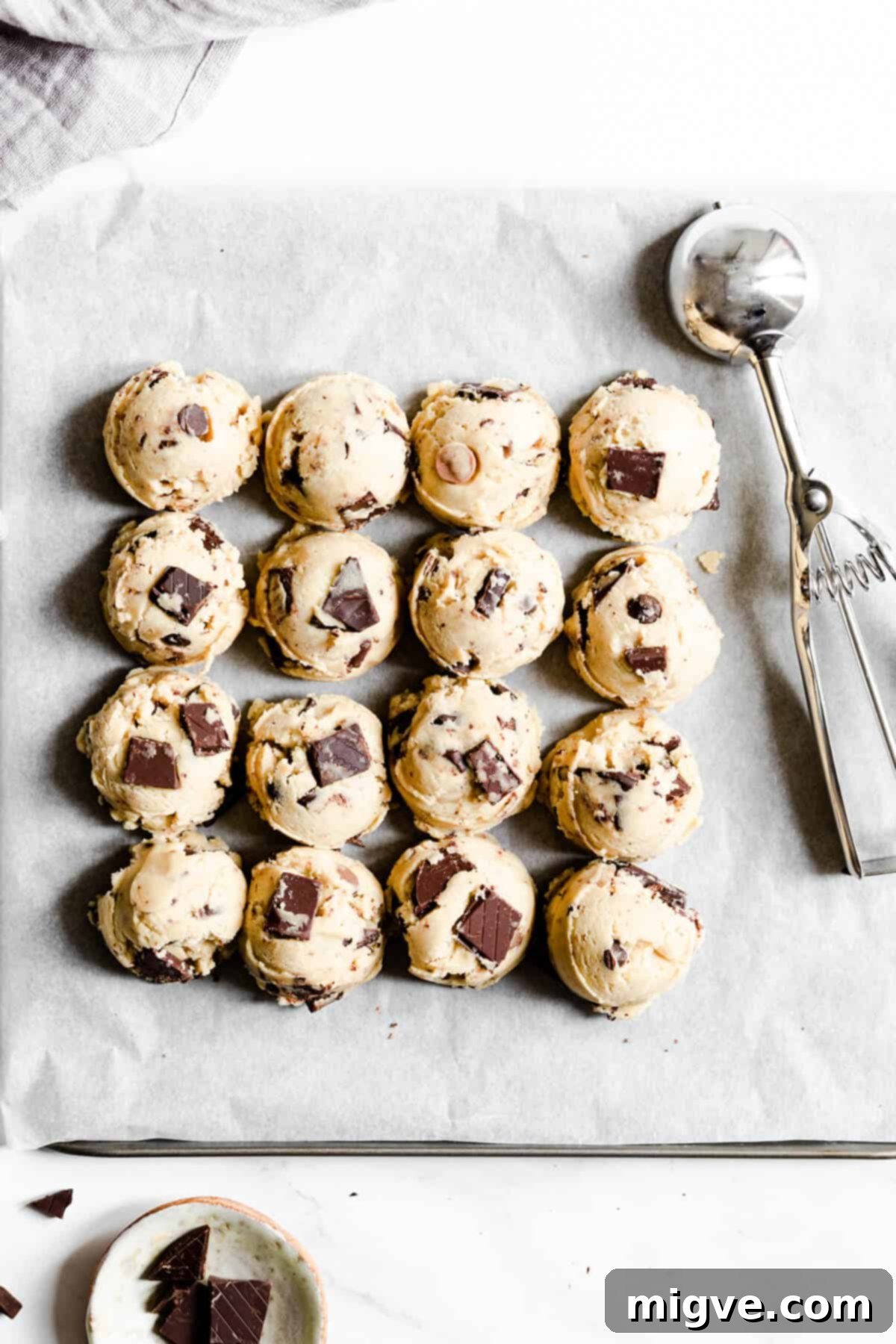 top view of balls of cookie dough on baking tray, spaced out