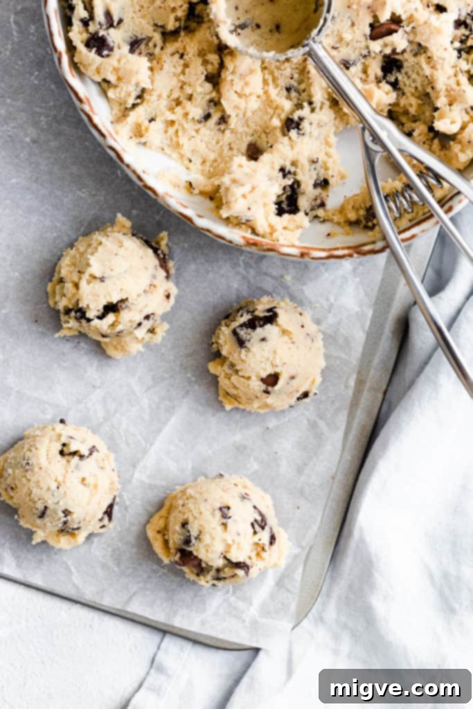 top view of raw cookie dough balls, showing the 'torn and stacked' technique