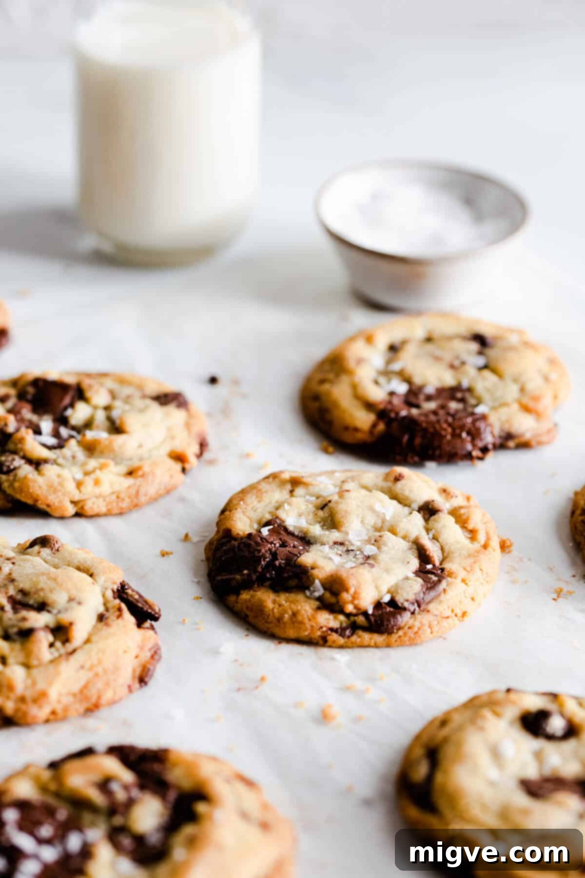 side close up of chocolate cookies sprinkled with sea salt flakes, enhancing their visual appeal