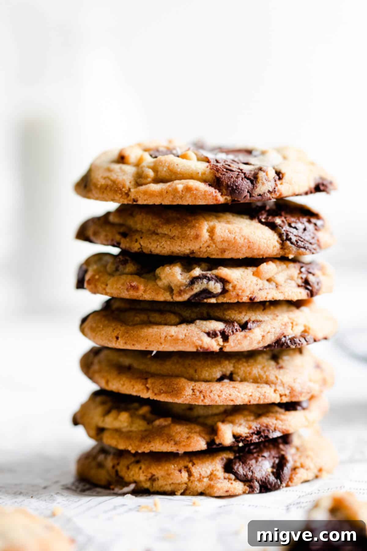side close up of a stack of chocolate cookies, showing their appealing height and texture