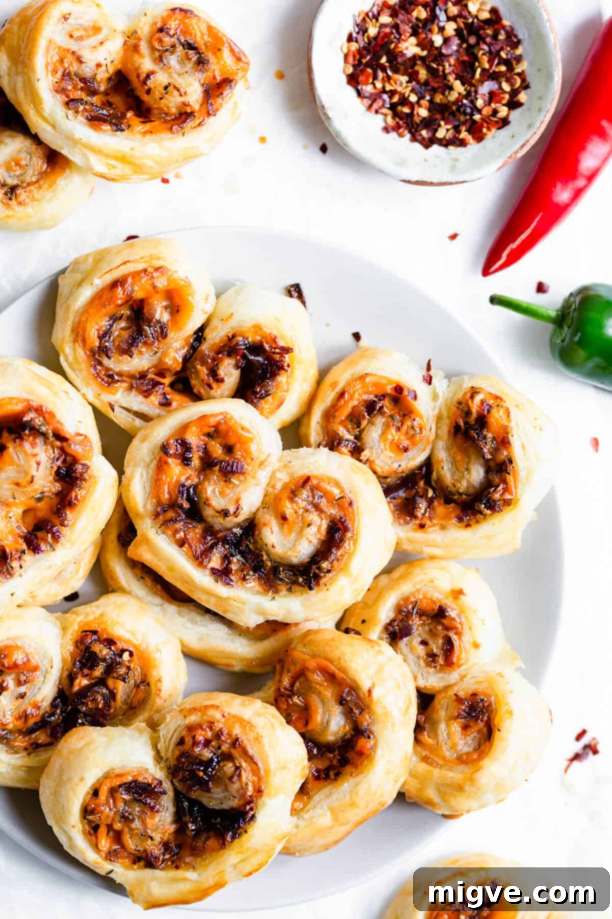 overhead shot of savoury palmiers arranged on a plate 