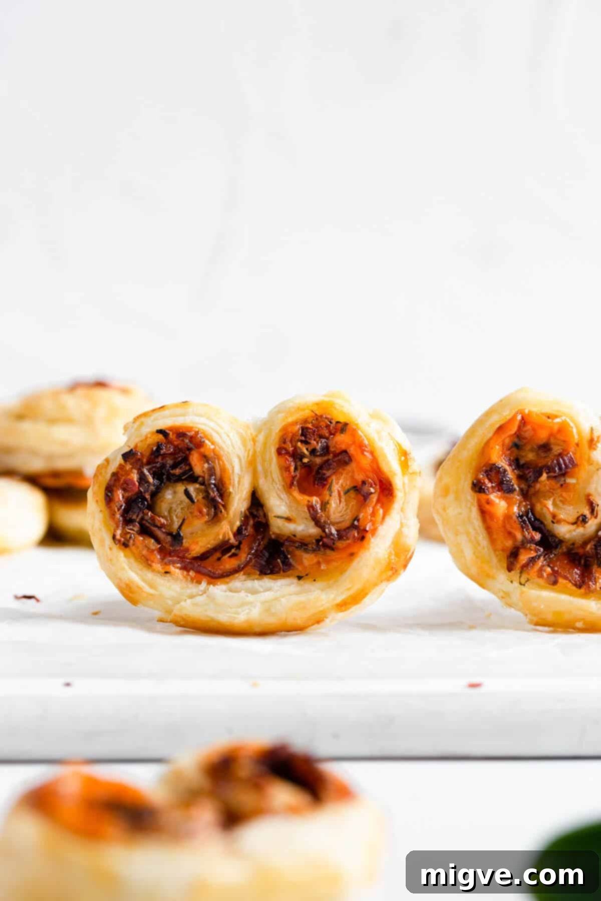 side shot of savoury palmiers with caramelised onion