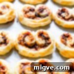 side close up of savoury palmiers on white surface