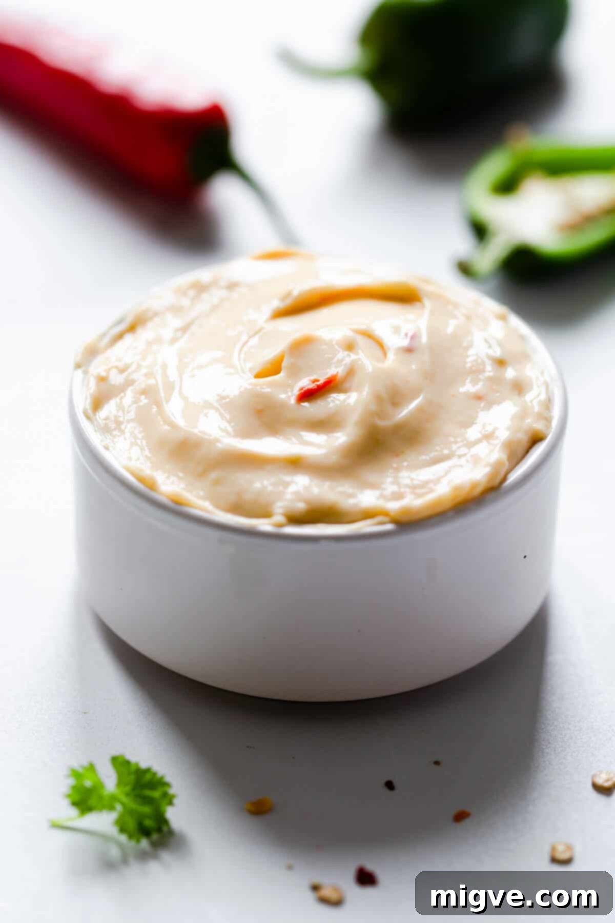 side close up of a small ramekin filled with cream cheese 