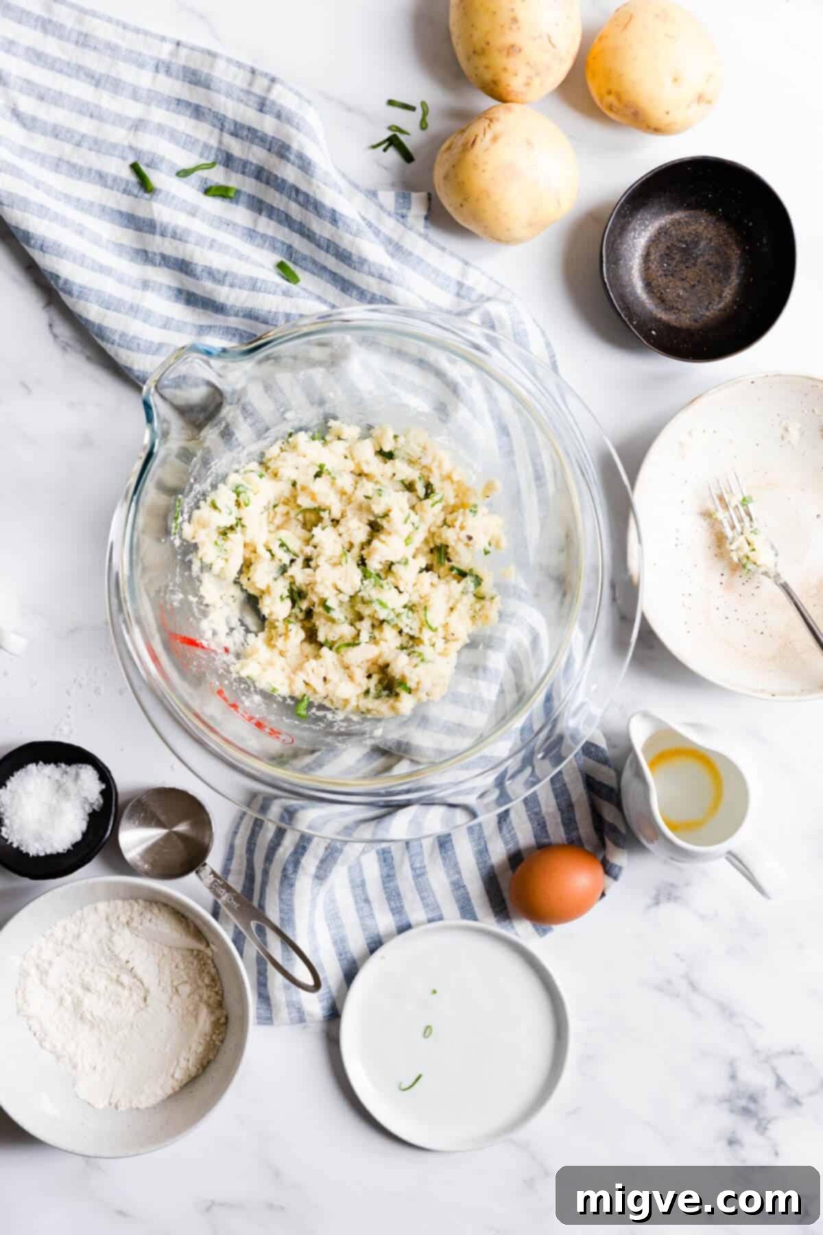 Top view of a bowl containing the chilled and firmed-up mixture for potato patties, ready for shaping.