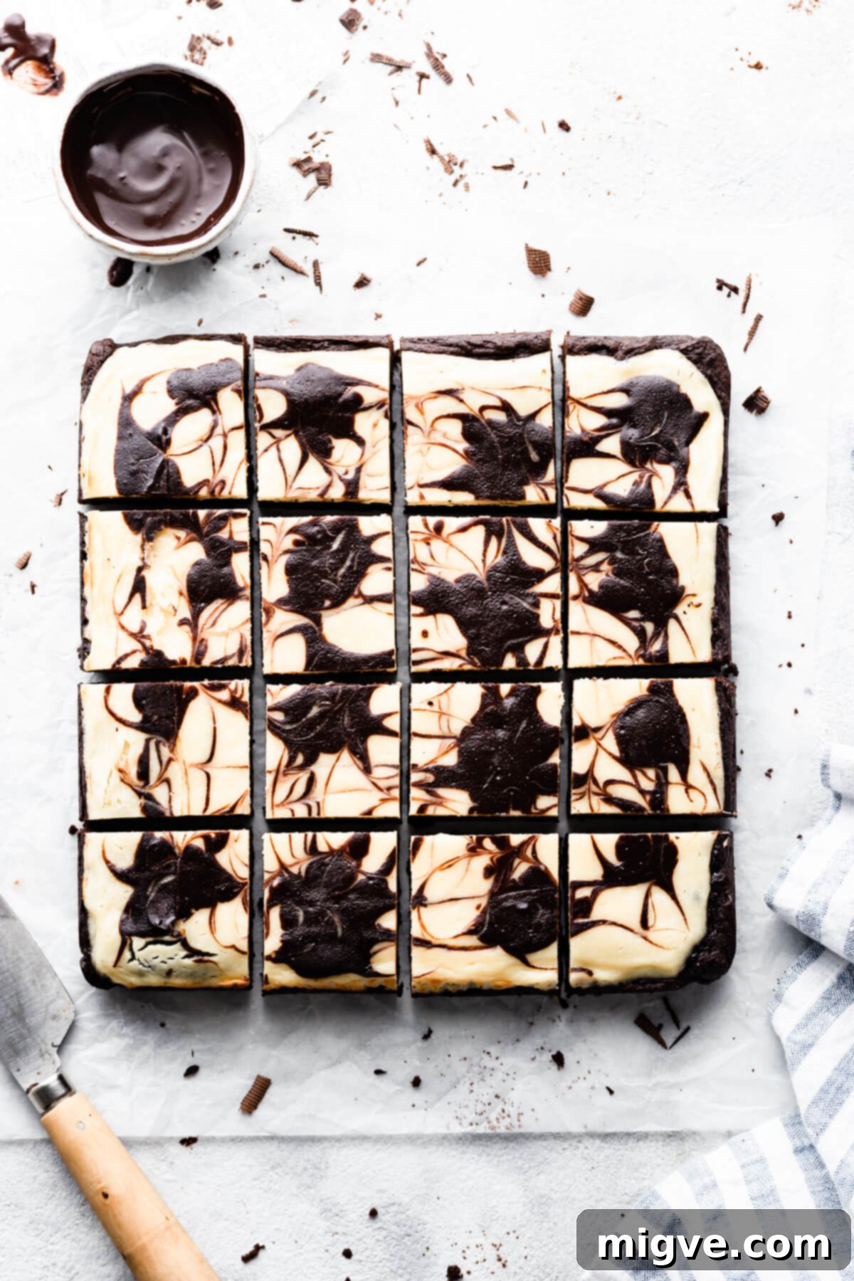 overhead shot of brownies with cheesecake cut into 12 individual squares