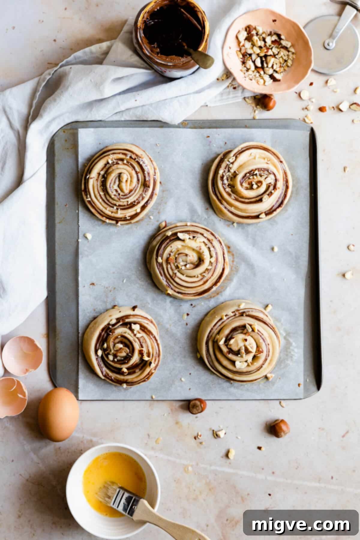 overhead shot of buns on a baking tray